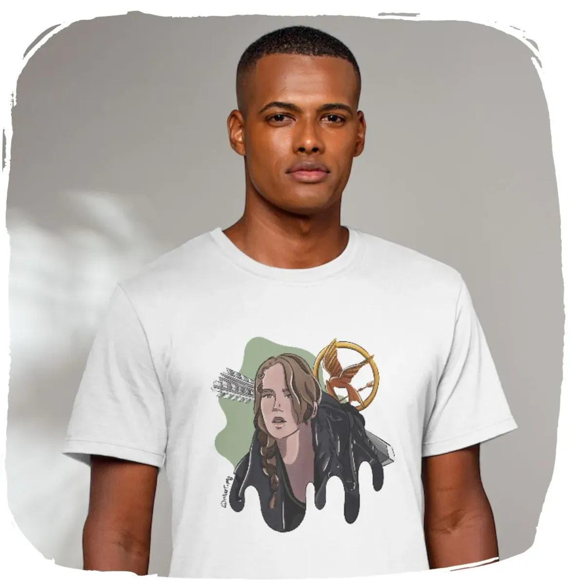 Nome do produto: Camisa Ellart Katniss Jogos Vorazes
